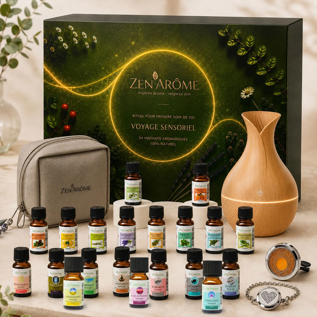 Zen Ârôme essential oils Advent Calender Set with a dark green gift box, a light wood diffuser, a gray zippered pouch, and multiple small amber bottles with colorful labels arranged on a tabletop.