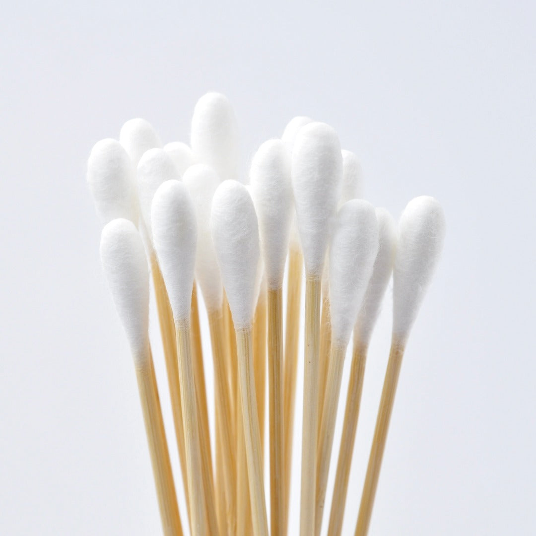 Bamboo cotton swabs on a light gray background
