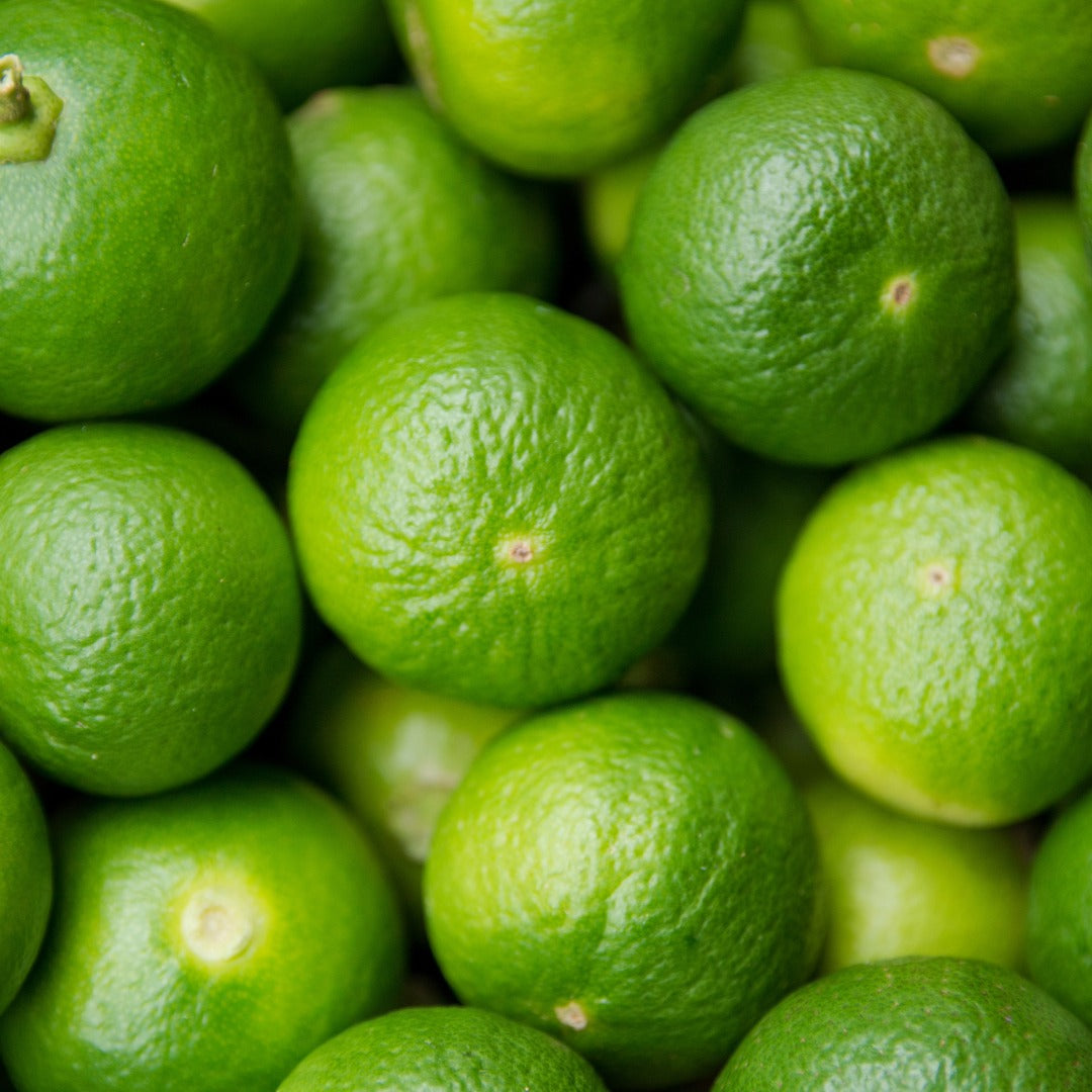 Close-up of a pile of green limes