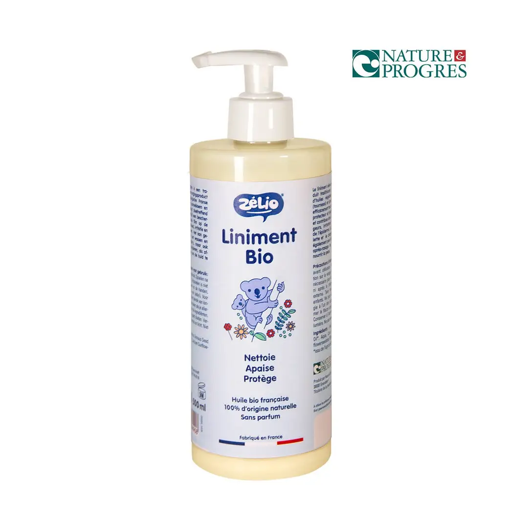 A bottle of Liniment Bio with a white pump dispenser and a blue koala illustration on the label, shown against a white background with a Nature Progres logo in the top right.