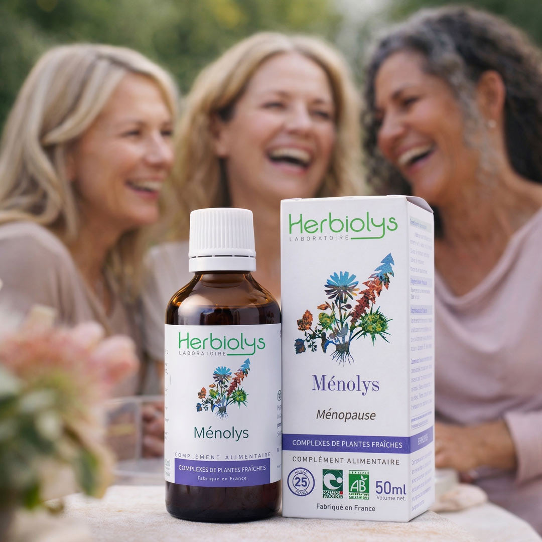 Herbiolys Menopausal supplement bottle and packaging with three women in the background.