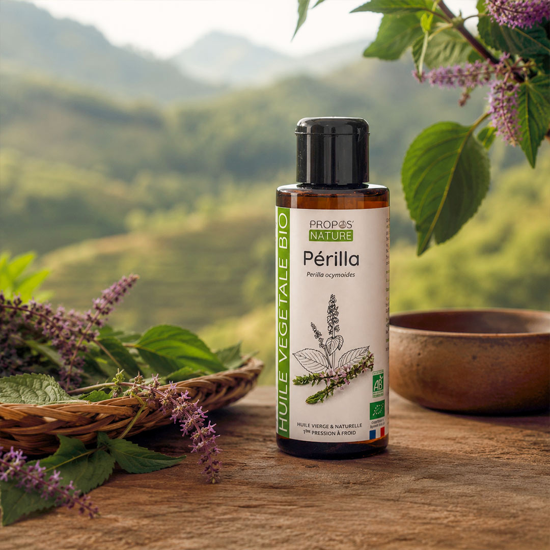 Bottle of Propos Nature Périlla oil on a wooden surface with a natural background
