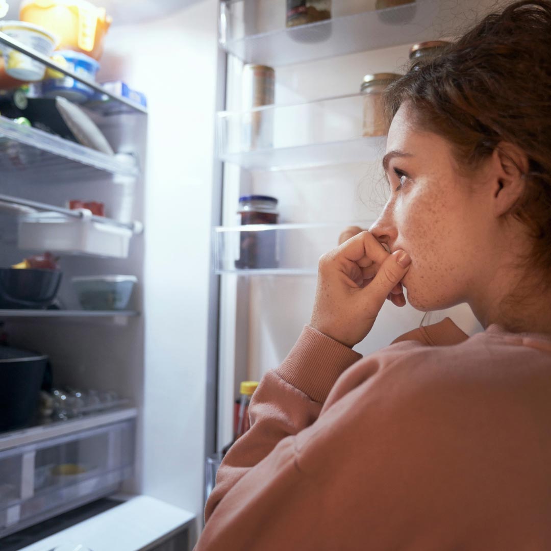 A woman looking into the fridge