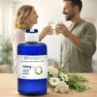 Bottle of essenciaqua Allerg product with a blurred background of two people holding glasses.