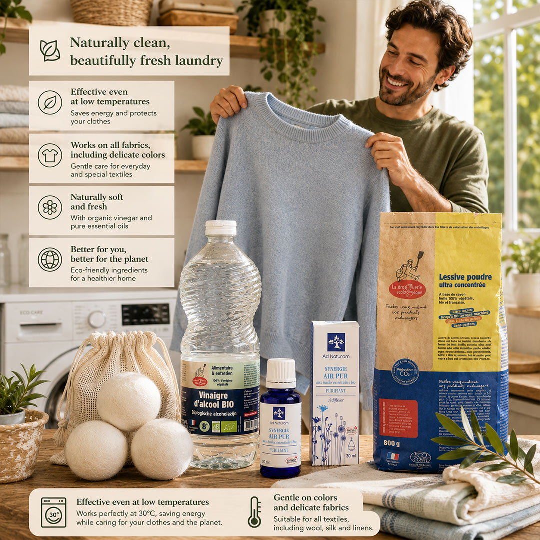 Naturally Fresh Laundry Kit displayed on a wooden countertop with organic laundry powder, organic alcohol vinegar, Clean Air Synergy essential oil blend and reusable wool dryer balls in a warm, sunlit Mediterranean laundry setting.