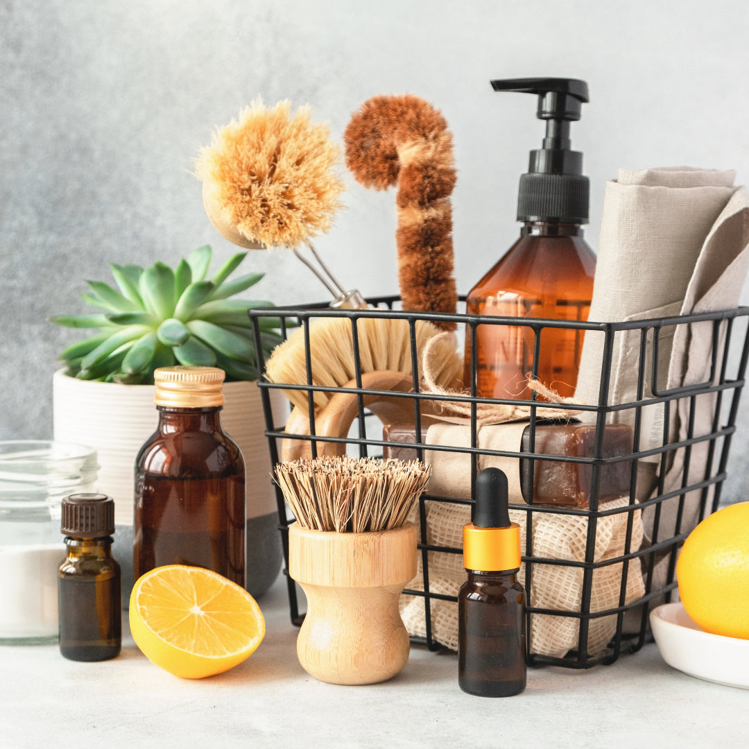 An image of organic and natural cleaning supplies with essential oils