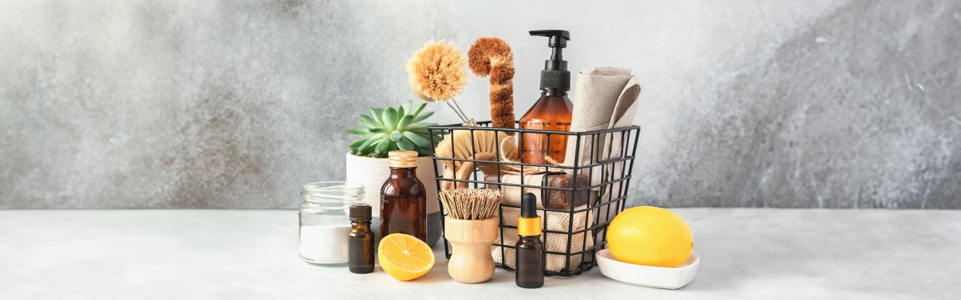 An image of organic and natural cleaning supplies with essential oils