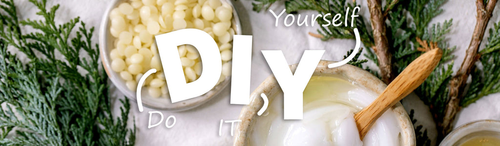 Banner image of cypress branches, olive nuggets and coconut oil in small ceramic bowls as ingredients in your do-it-yourself cosmetics and hygiene products