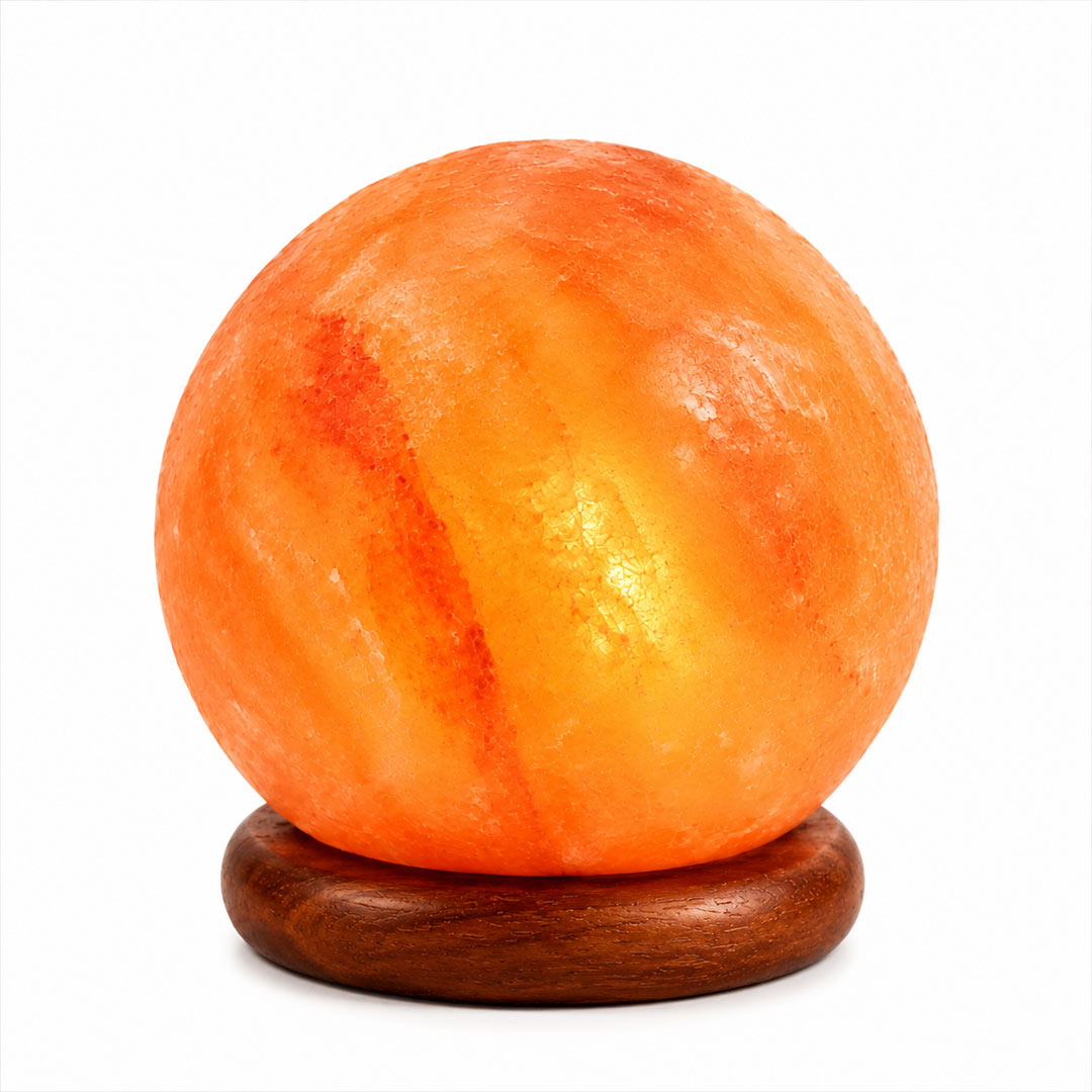 A glowing Himalayan salt Moon lamp with natural marbling, resting on a round dark brown wooden base against a plain white background.