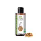A bottle of Propos Nature Souchet (Tigernut oil) vegetable oil next to a small pile of whole souchet seeds on a white background.
