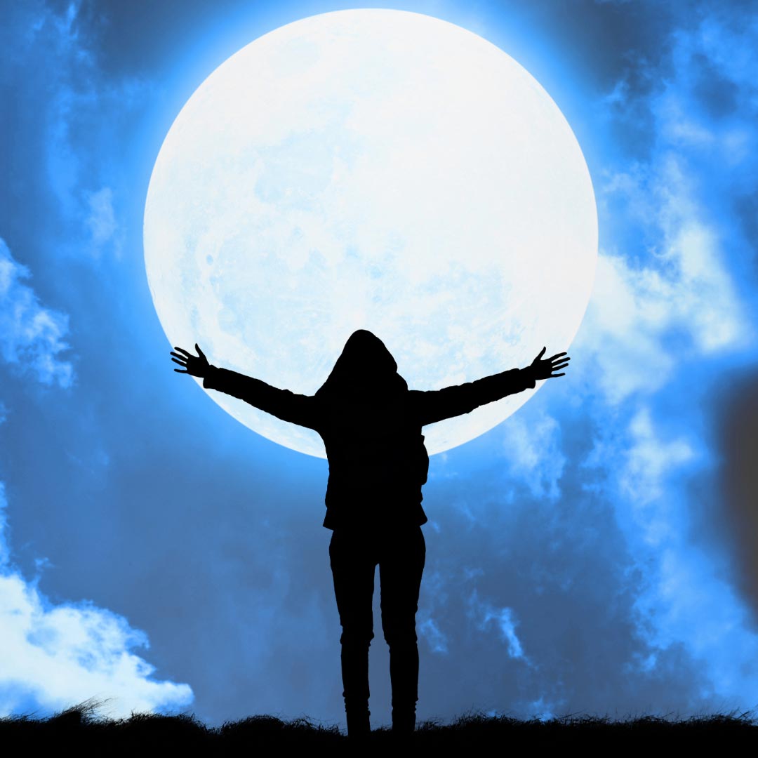A woman holding the moon